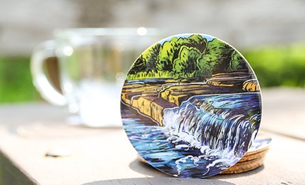 A photo of a coaster with an illustrated image of Vanderwater CA.